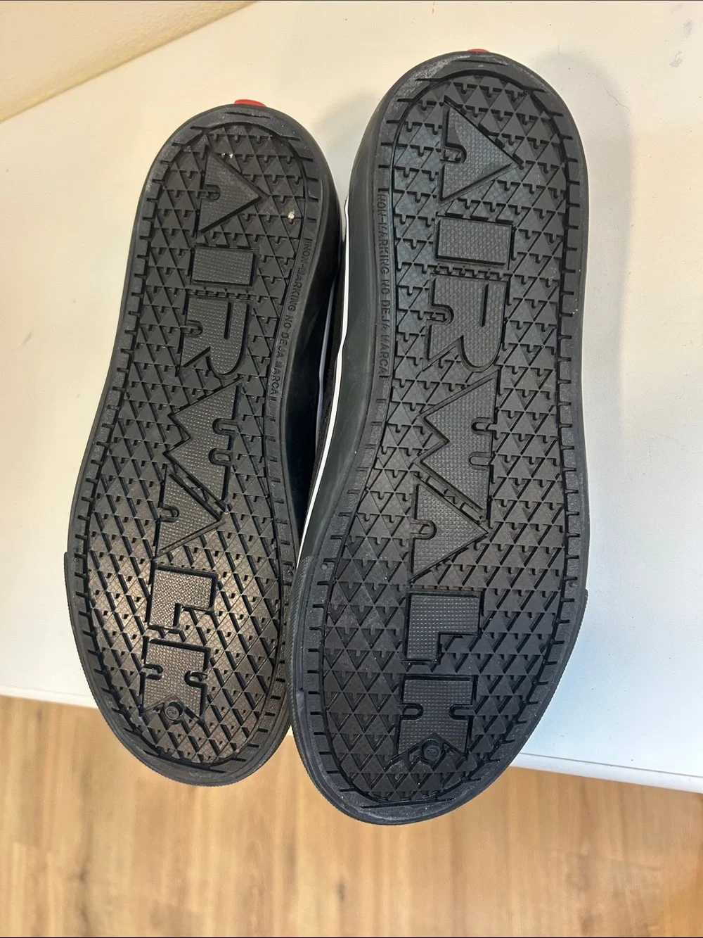 Airwalk Black Slip-On Sneakers with White Skeletal Foot Print